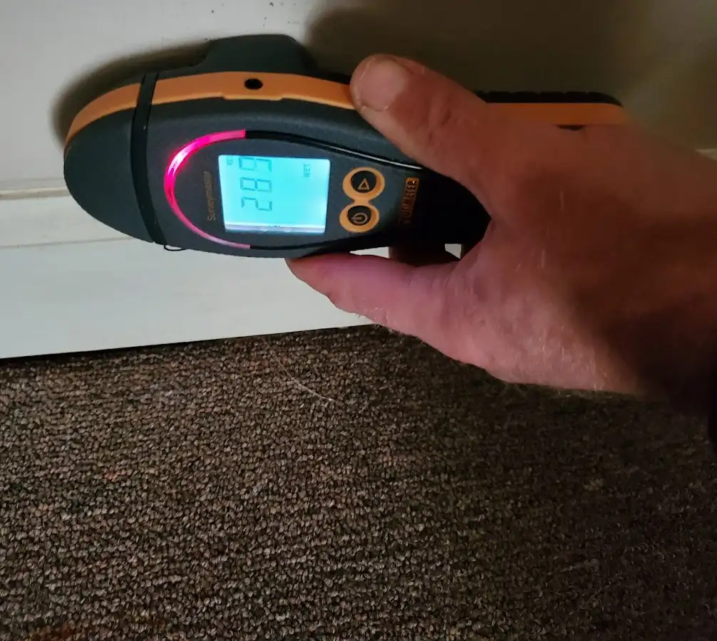 Moisture detection at baseboard during Storm Damage Restoration in West Linn